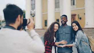 A photographer takes a picture of happy friends.