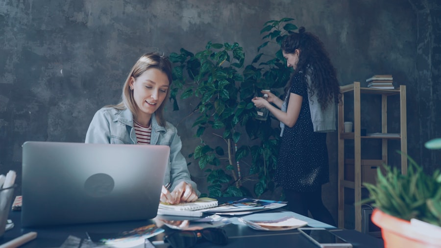 Two creatives collaborating in a bright studio office