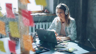 A woman is working on her laptop.