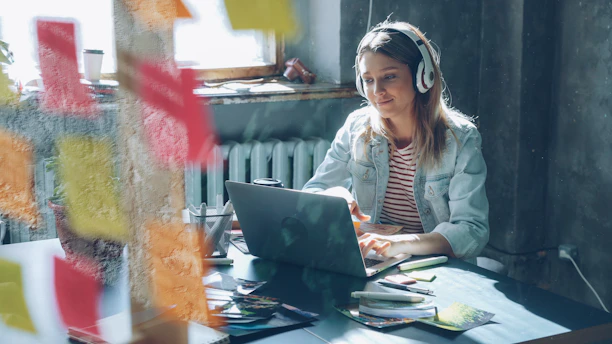 A woman is working on her laptop.