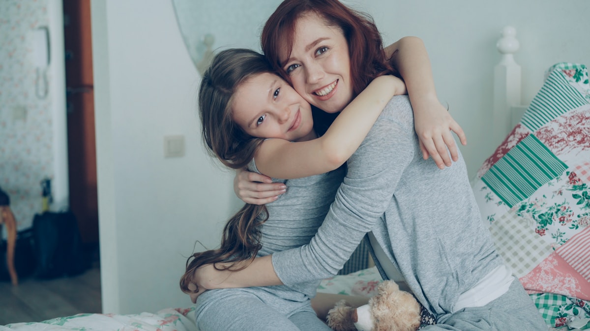 Elderly lady and daughter hugging