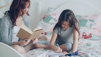 Mom helps her daughter with her homework.