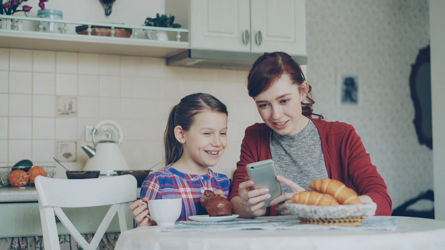 A mother and daughter sharing a phone
