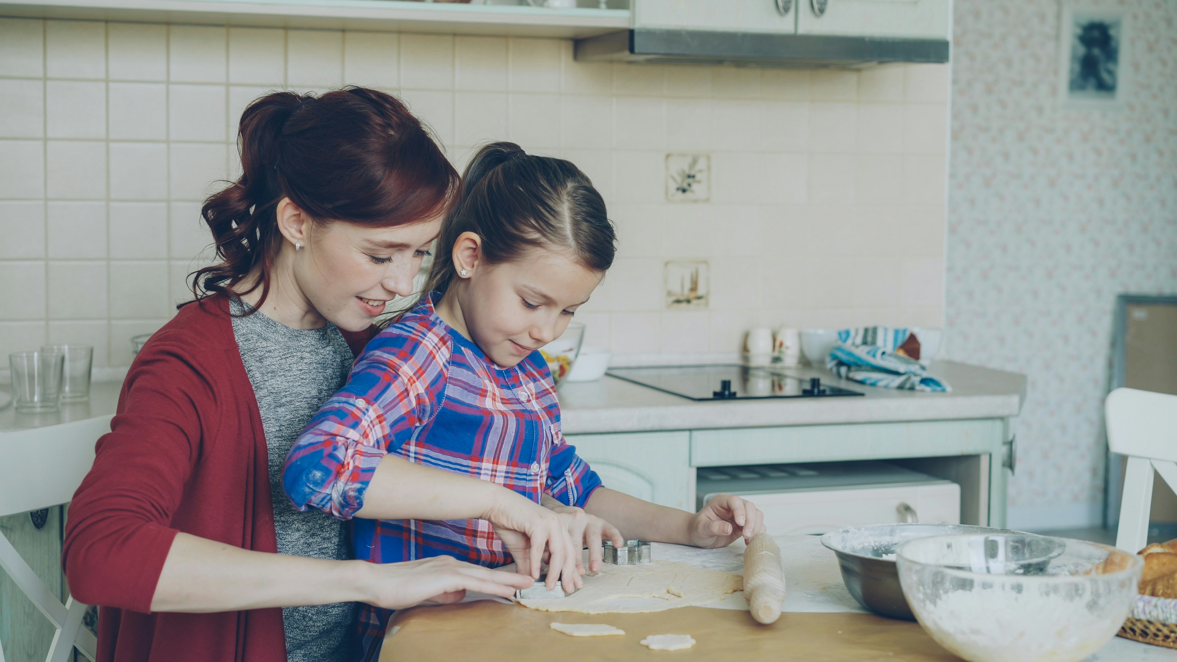 child helping prepare a simple meal with a parent - daily living skills aba