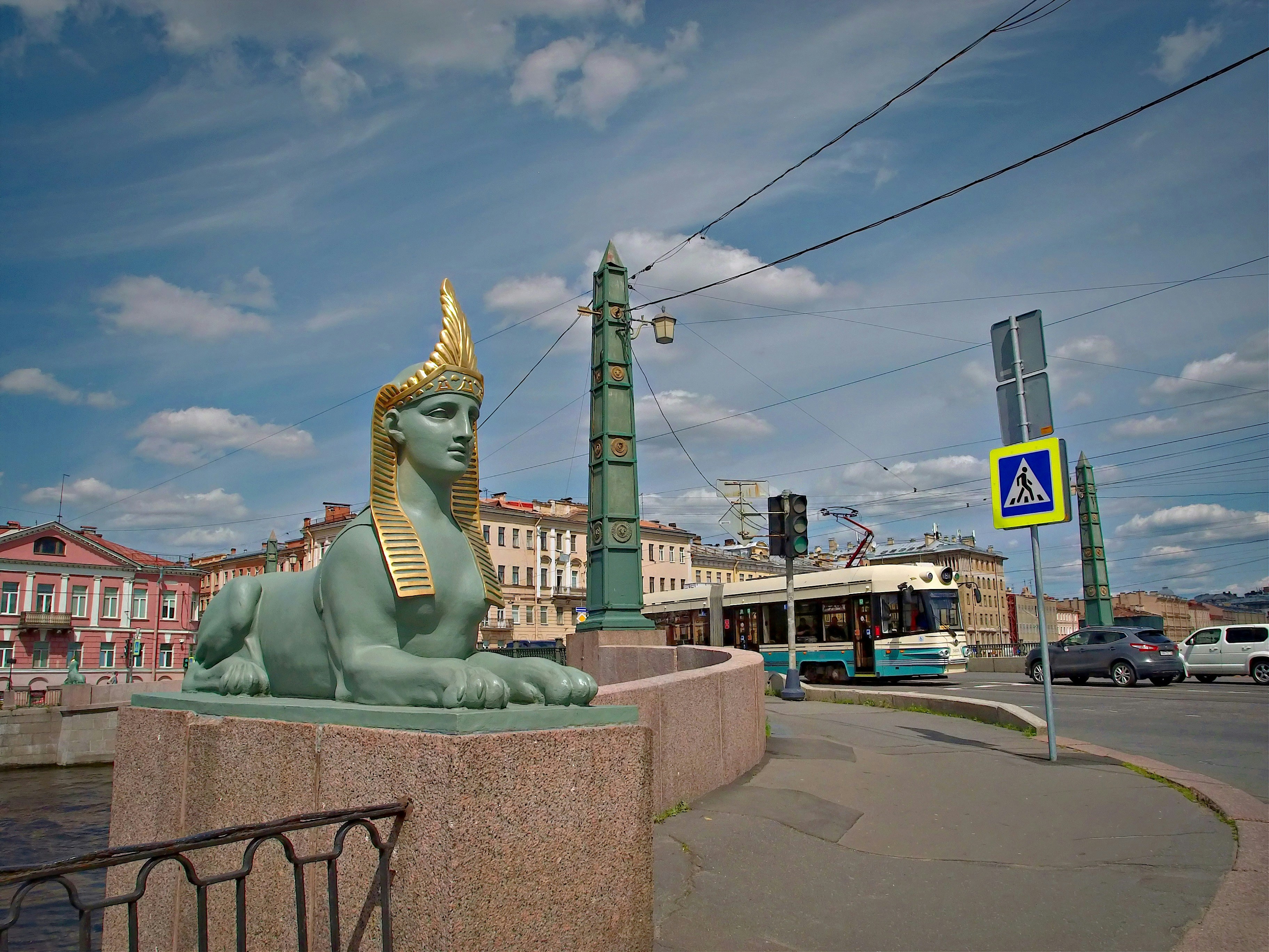 An egyptian sphinx statue by a bridge in st. petersburg.