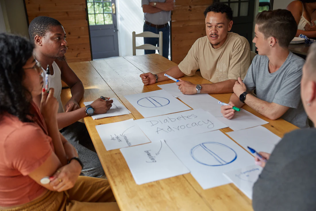 A group of people working around a table