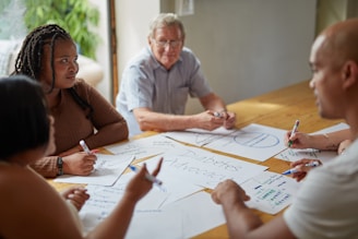 People are working together at a meeting.