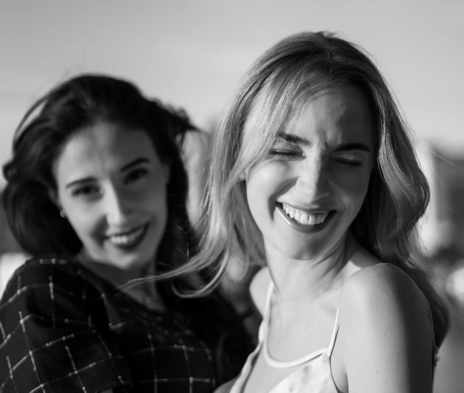 Two smiling women are posing for a photograph.