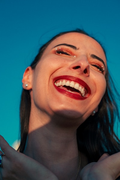 Woman laughing with joy showing confident smile