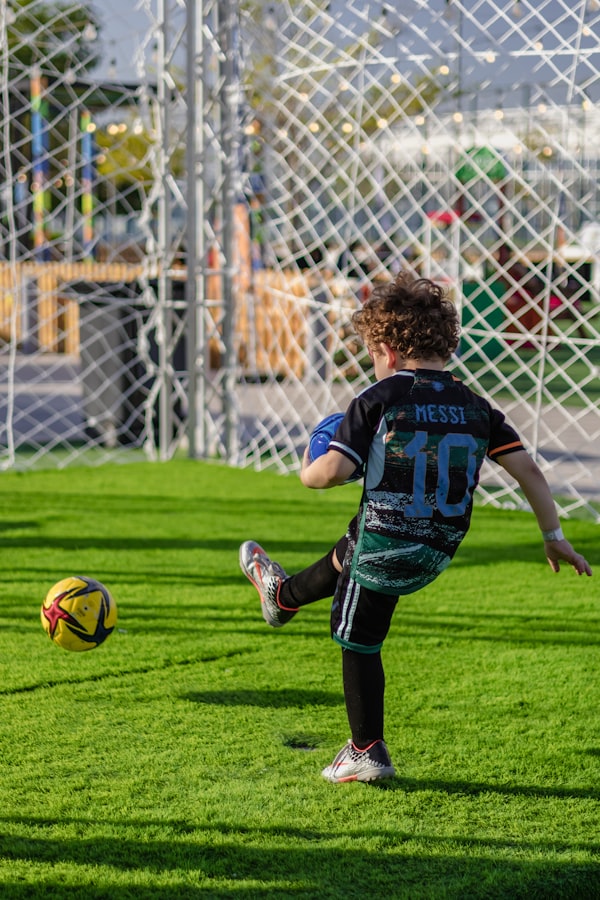 Kid kicking soccer ball