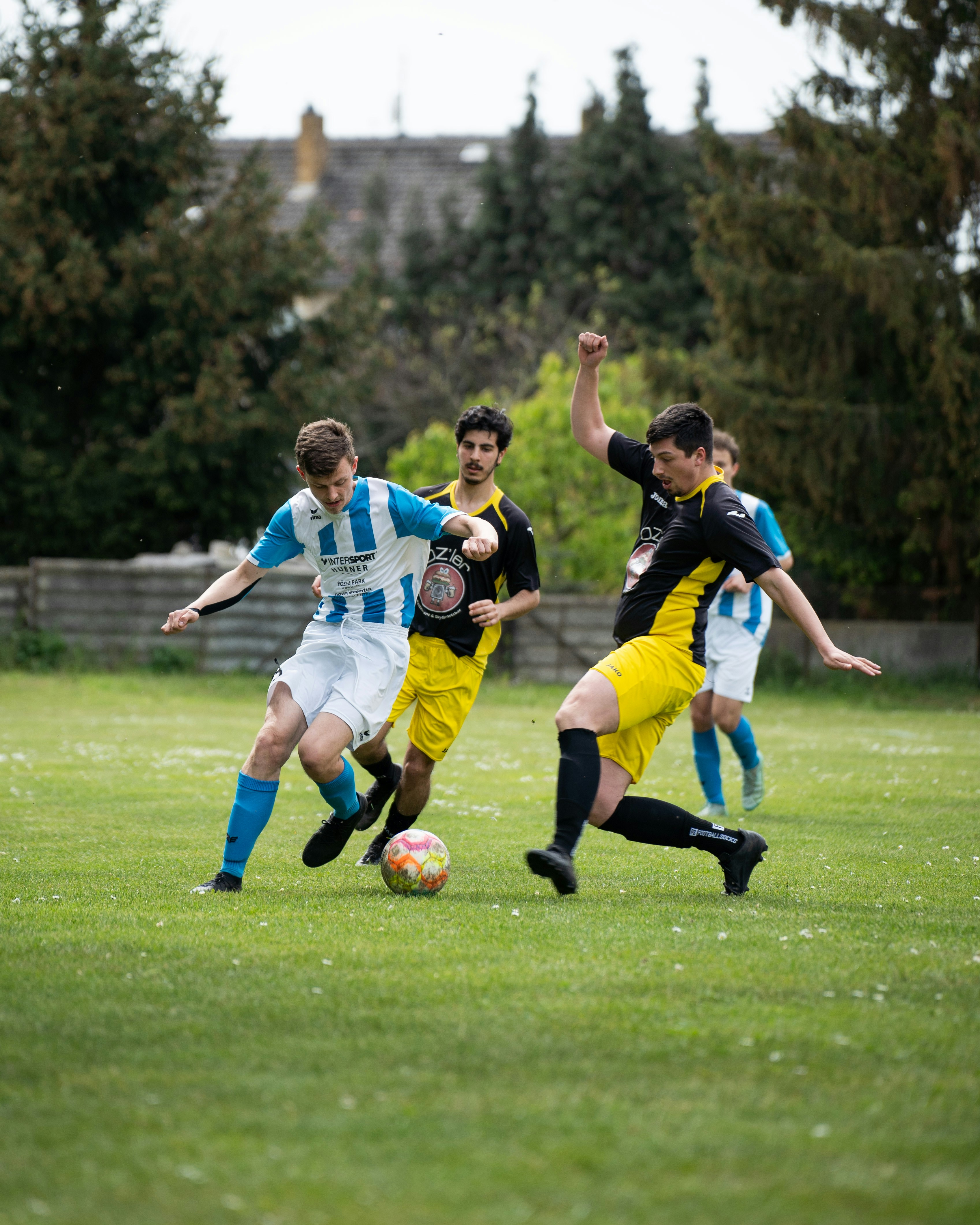 Soccer players are in action during a game.