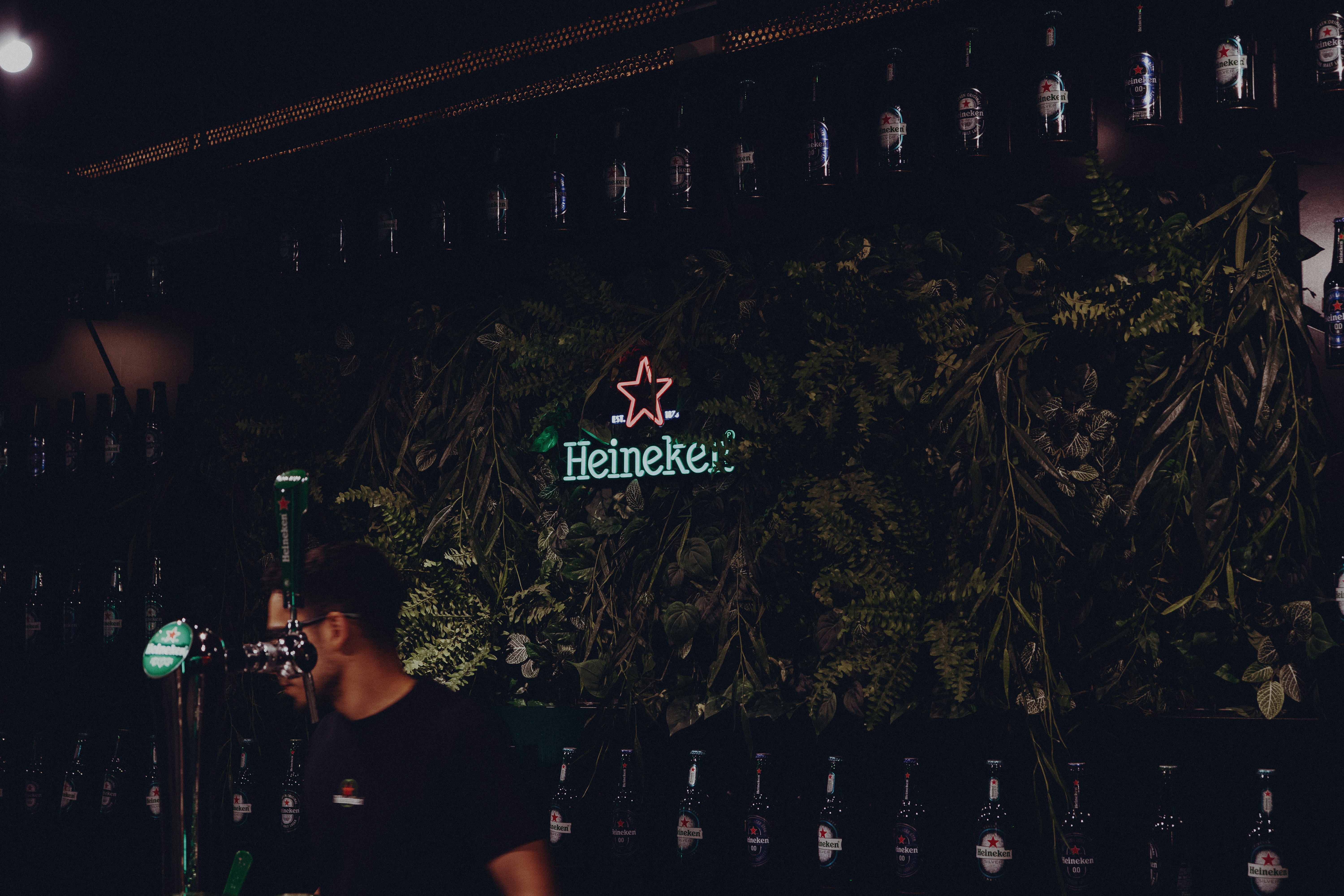 Bar with green wall and neon sign