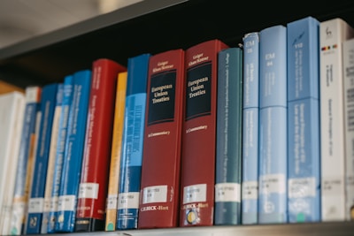 Books are neatly arranged on a bookshelf.