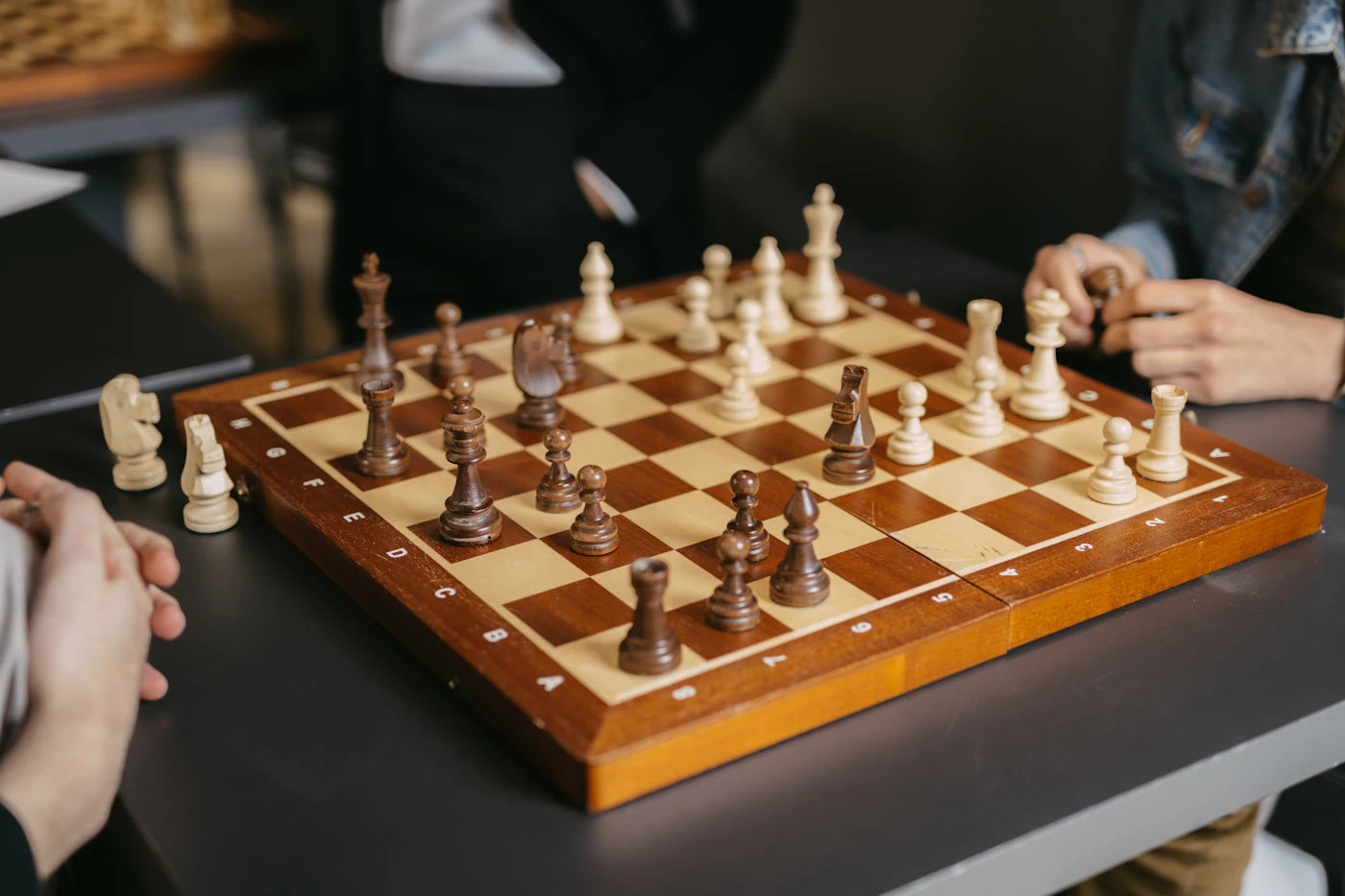 Friends playing a social game of chess together
