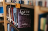 A book about administrative justice is on a shelf.