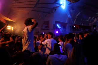People are dancing and partying at a club.