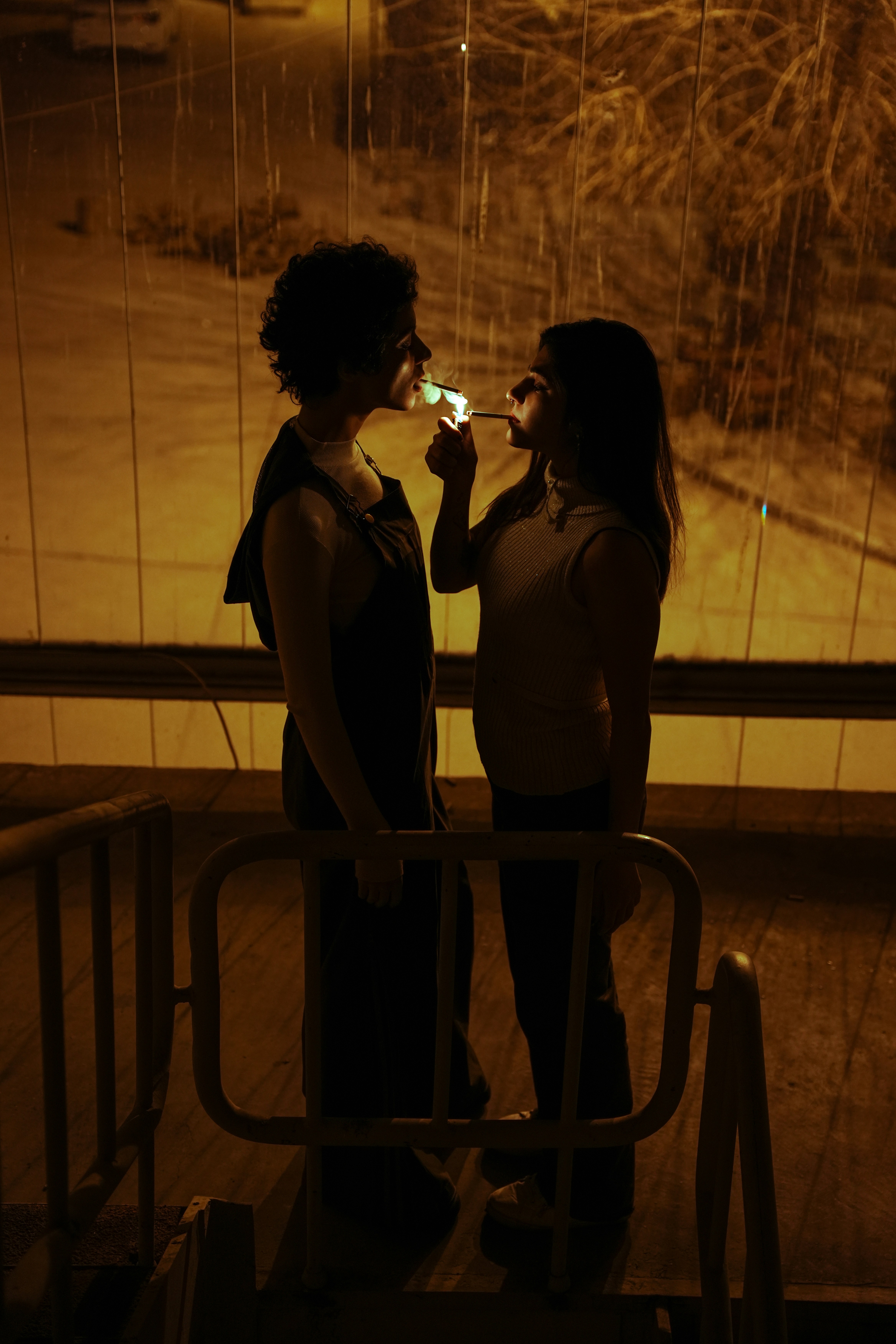man and woman sharing cigarette Two people share a cigarette in the night. photo – Free Woman Image on  Unsplash