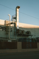 Factory building with ventilation and exhaust equipment.