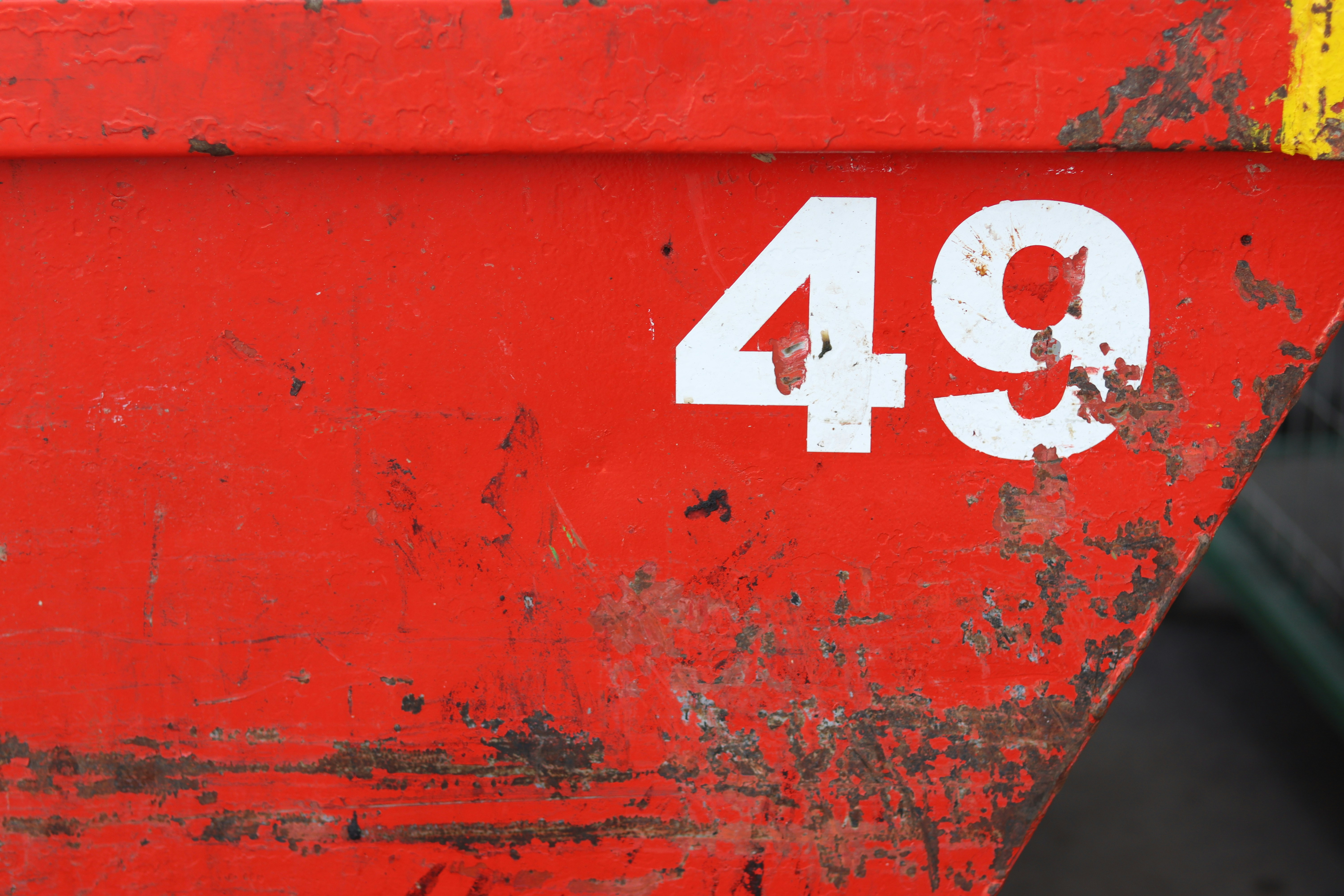 The number 49 is on a red surface.