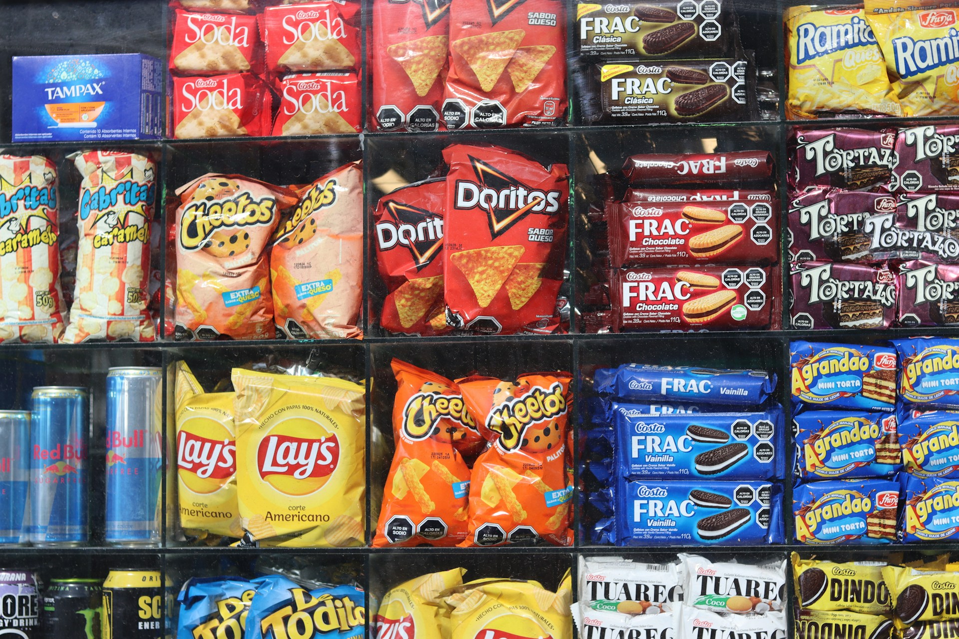 Shelves are filled with various snacks and drinks.