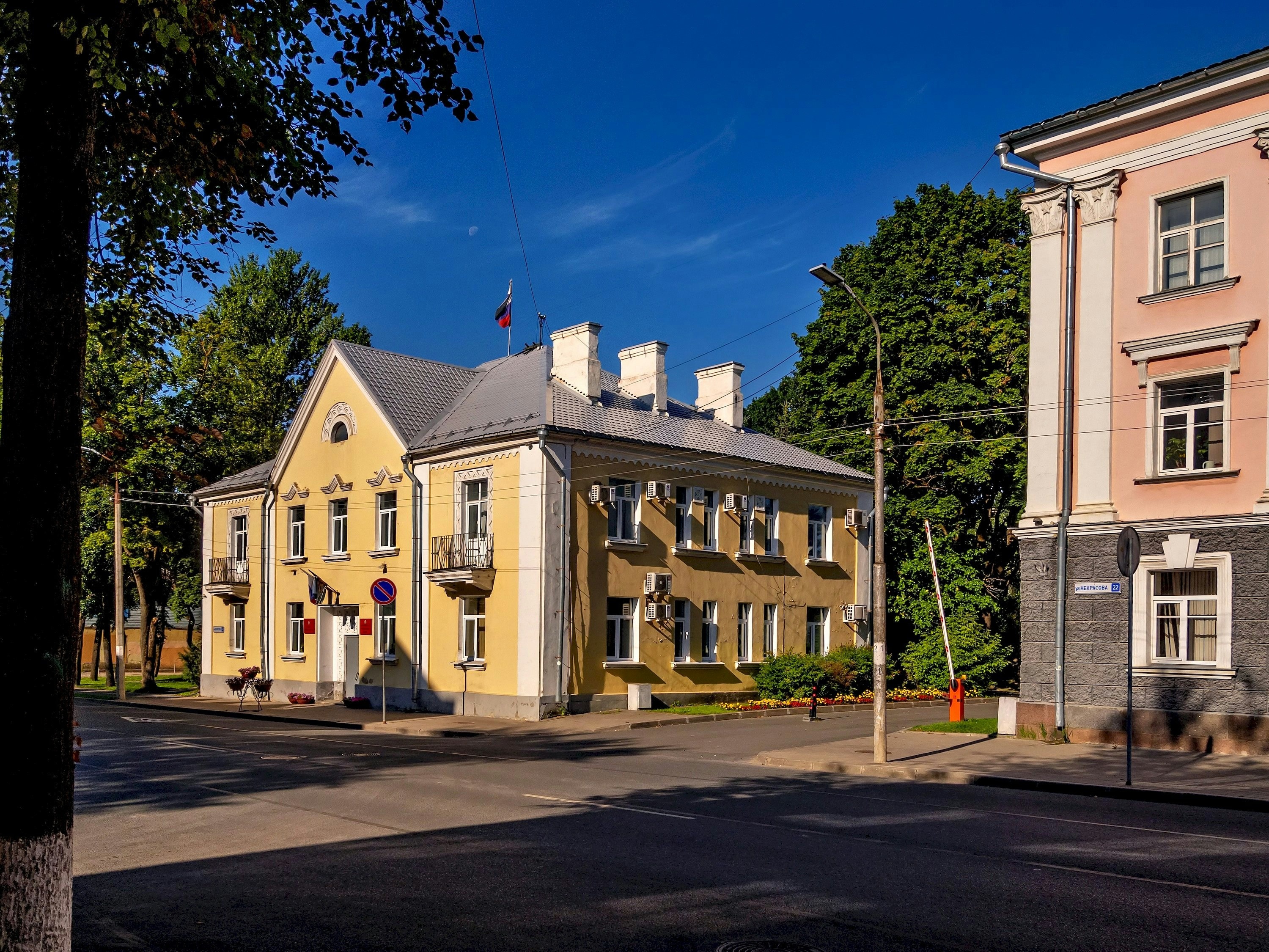 Old buildings stand on a sunny, clear day.