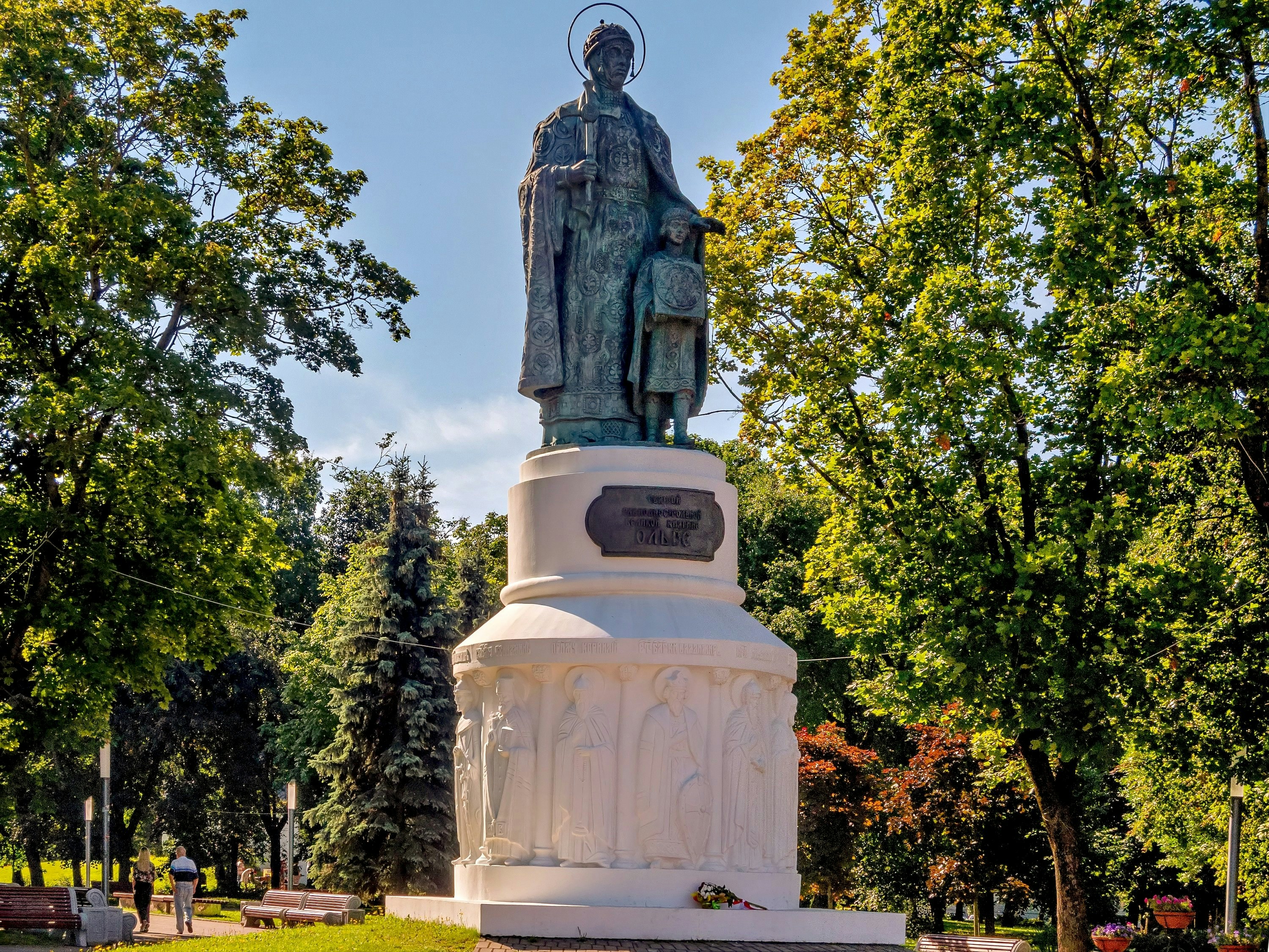 A statue of a saint and child stands tall.