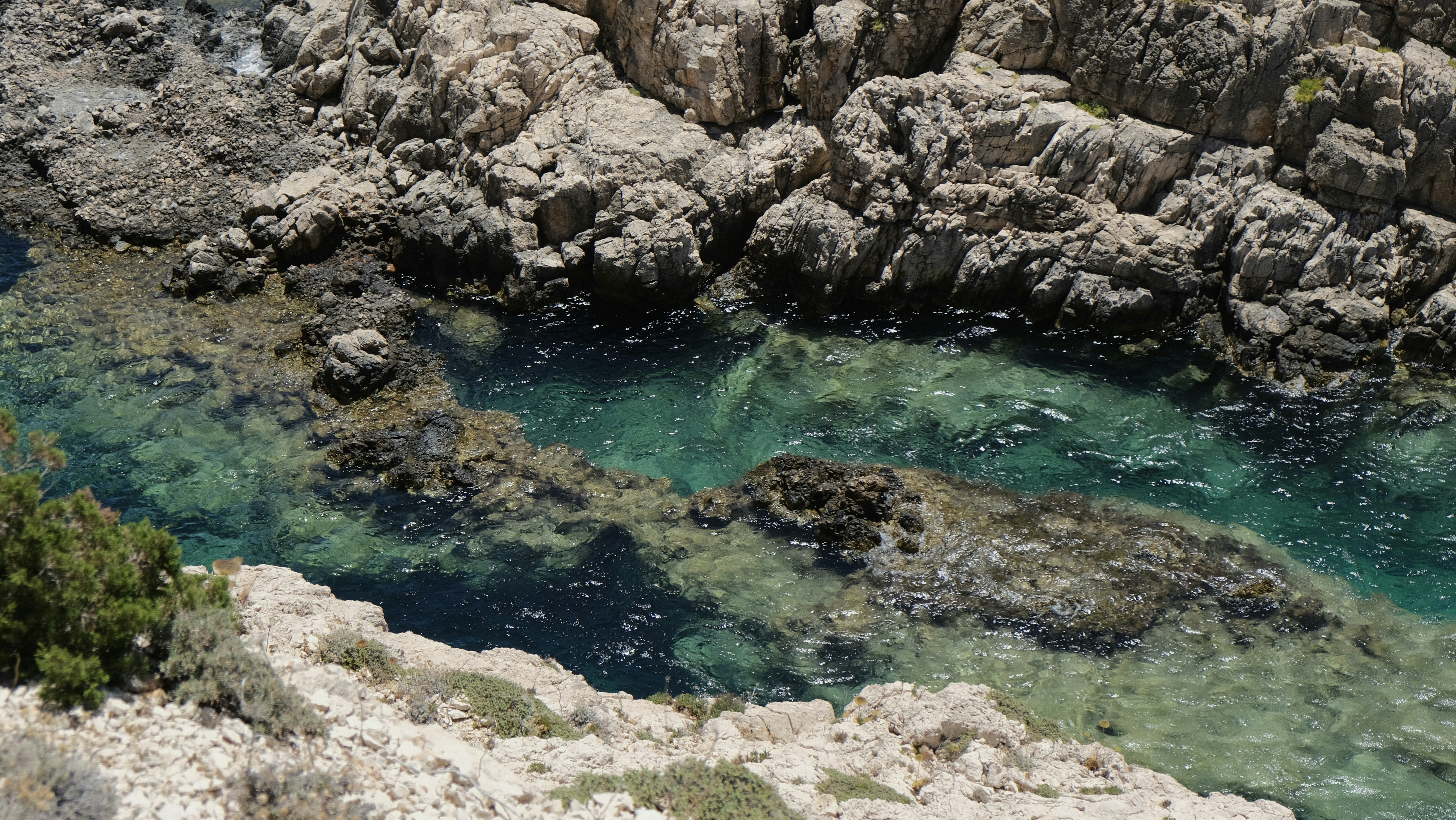 Rocky coastline with clear turquoise water.