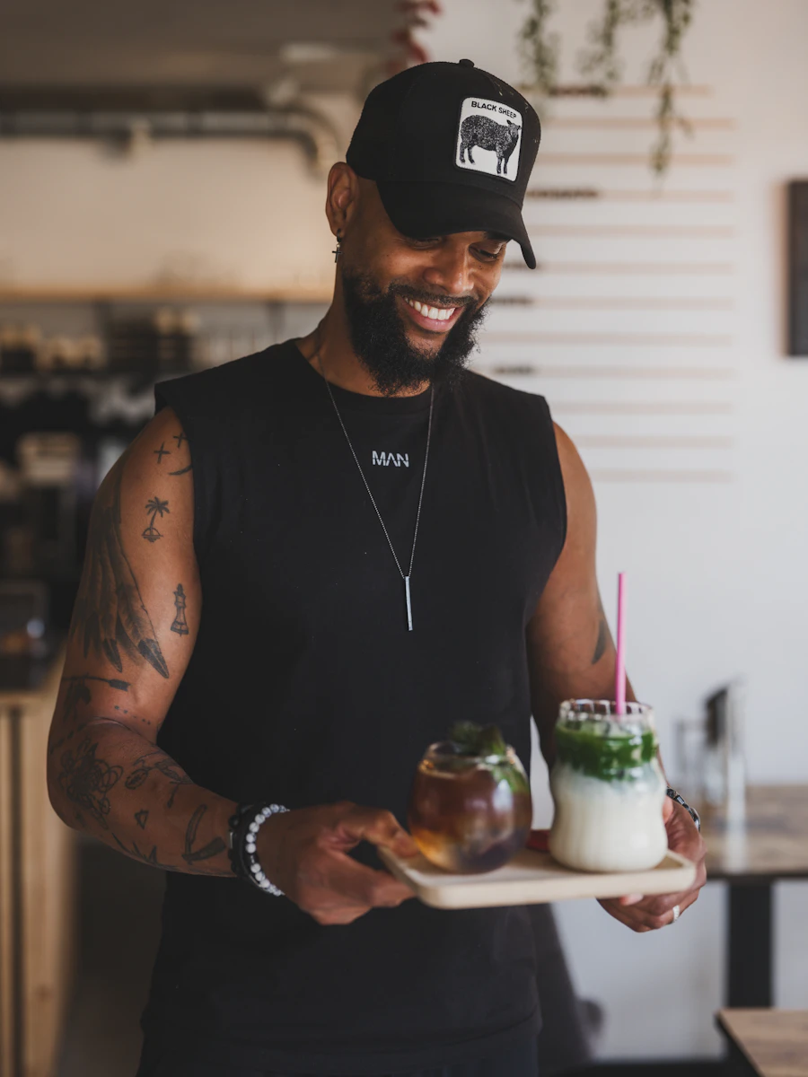A matcha-bar owner serving drinks inside the business