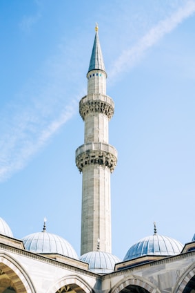 A mosque's minaret reaches towards the sky.