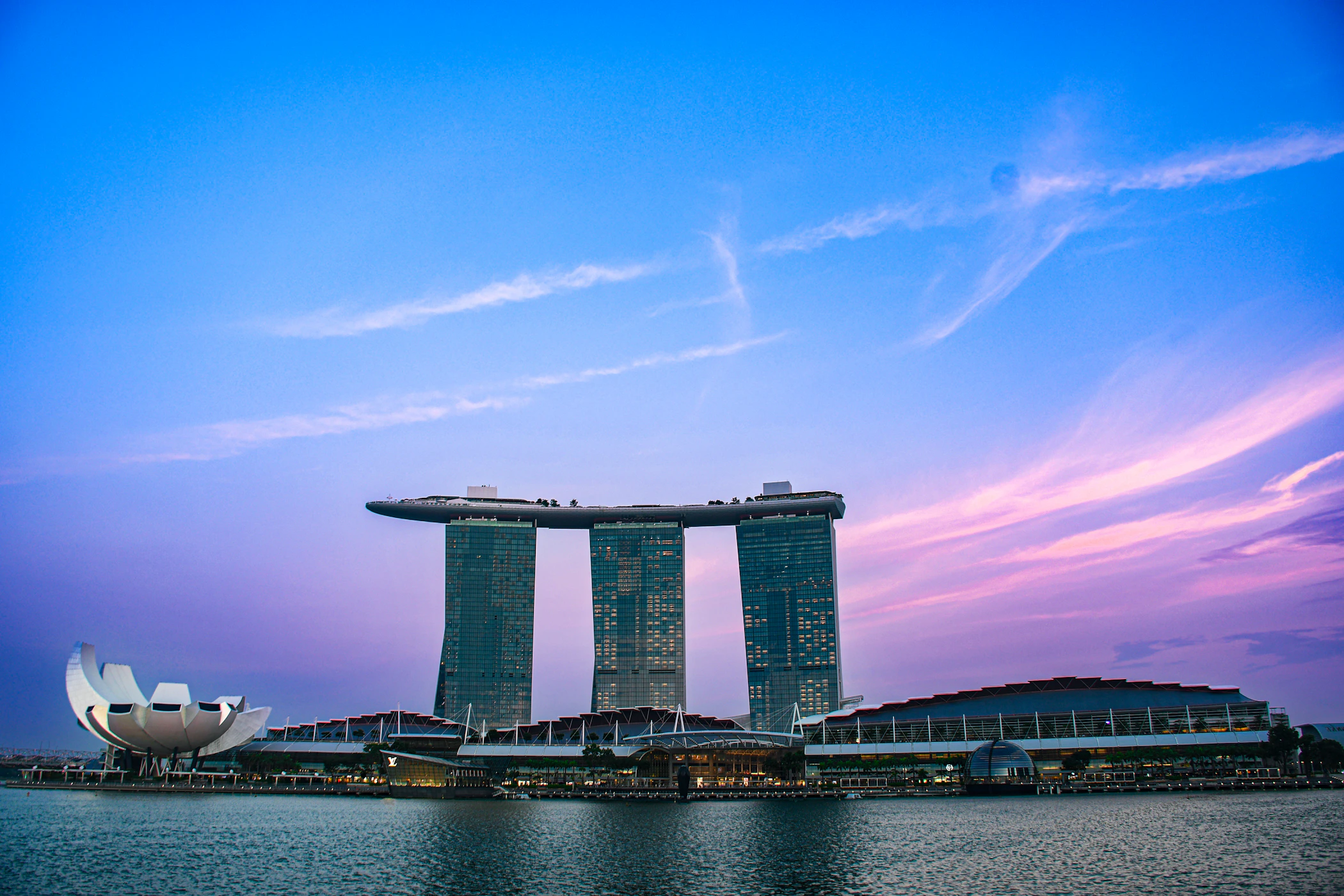Marina Bay Sands and ArtScience Museum glowing at sunset in Singapore