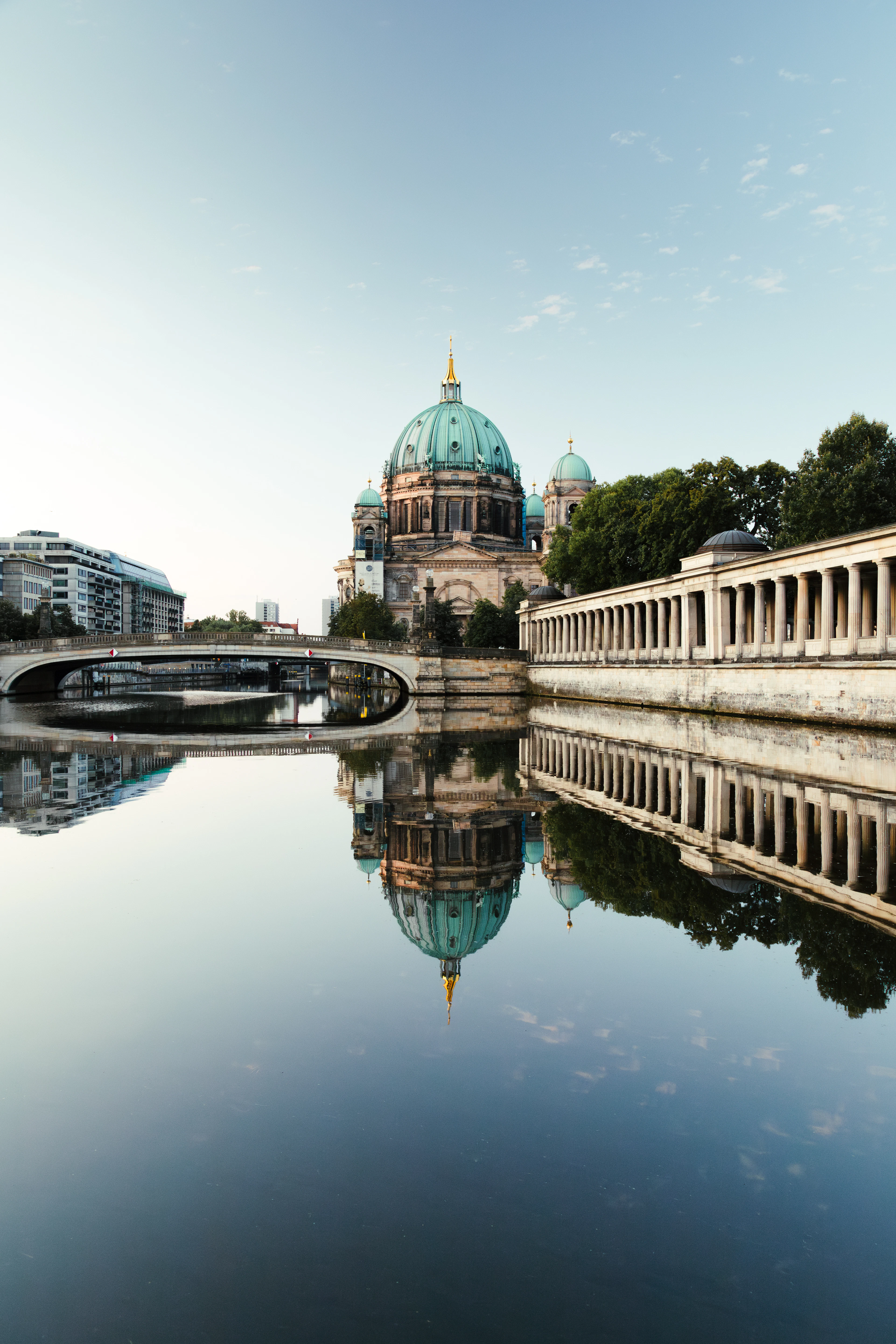 The Berliner Dom reflected in the water beside Museum Island in Berlin