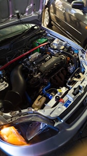 A modified honda engine under the hood.