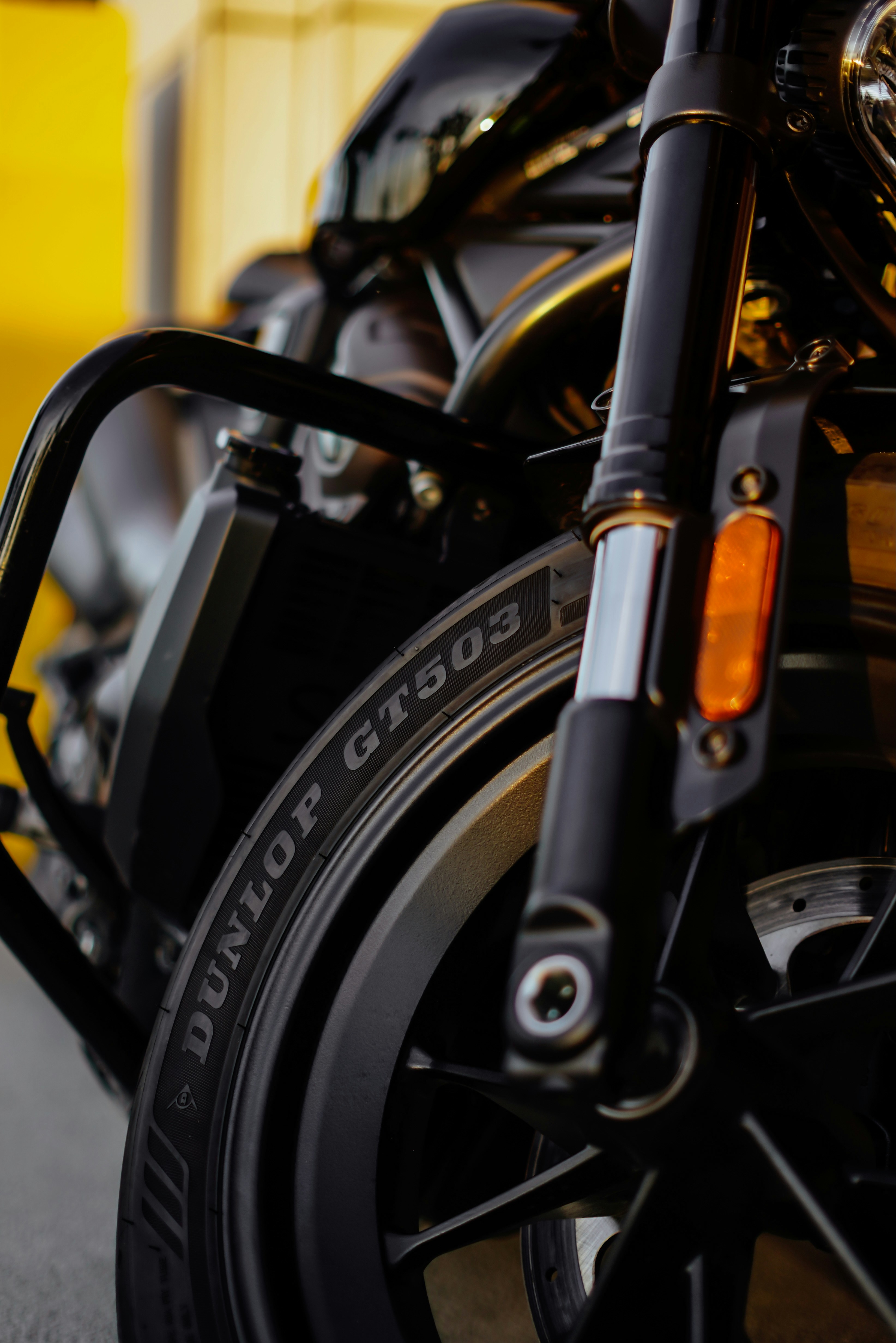 A close-up shot of a black motorcycle.