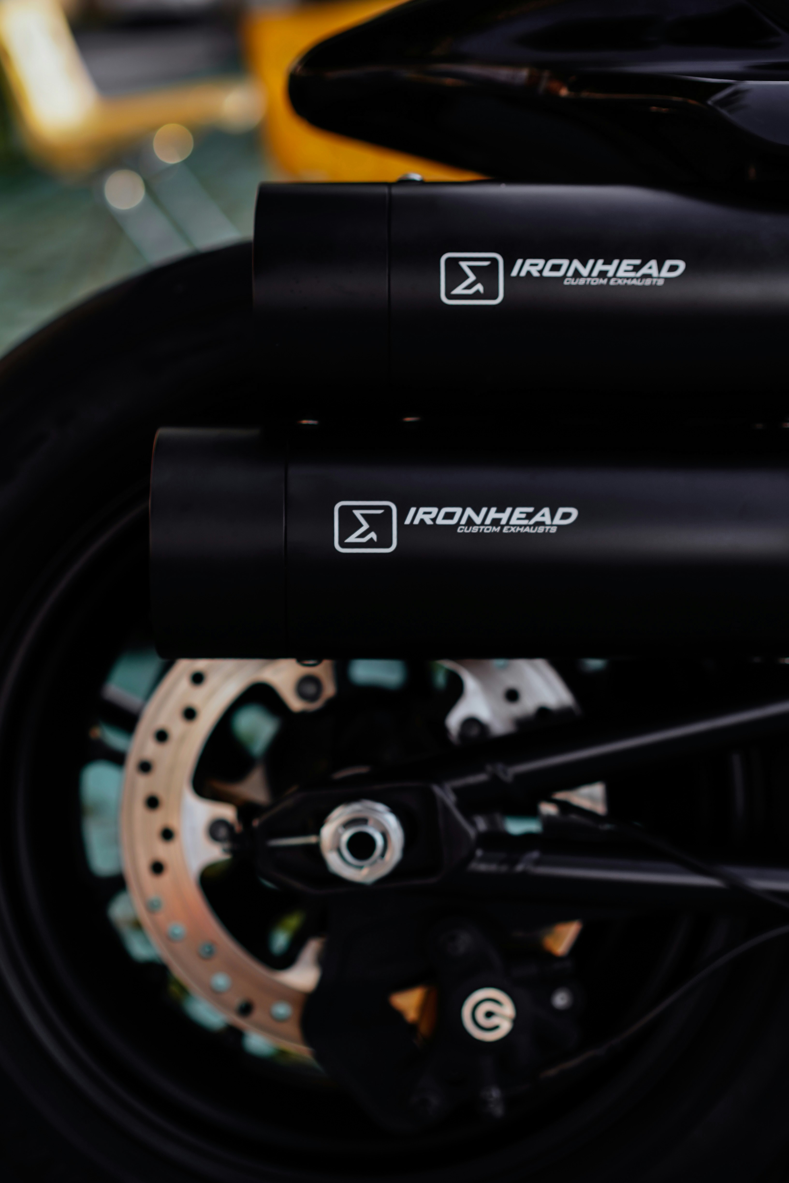 Motorcycle exhaust pipes with the "ironhead" brand.
