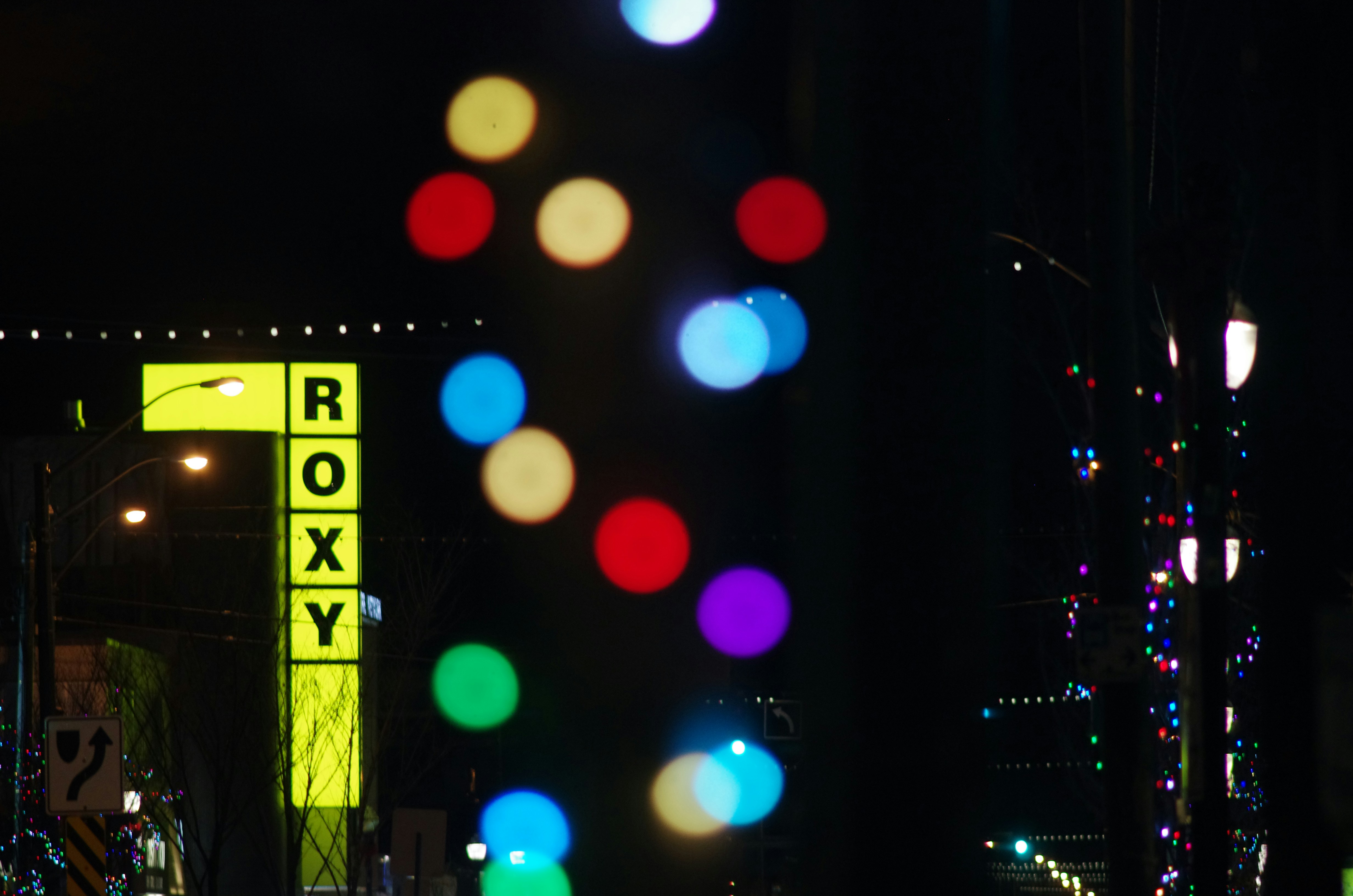 marquee sign at night with colored lights