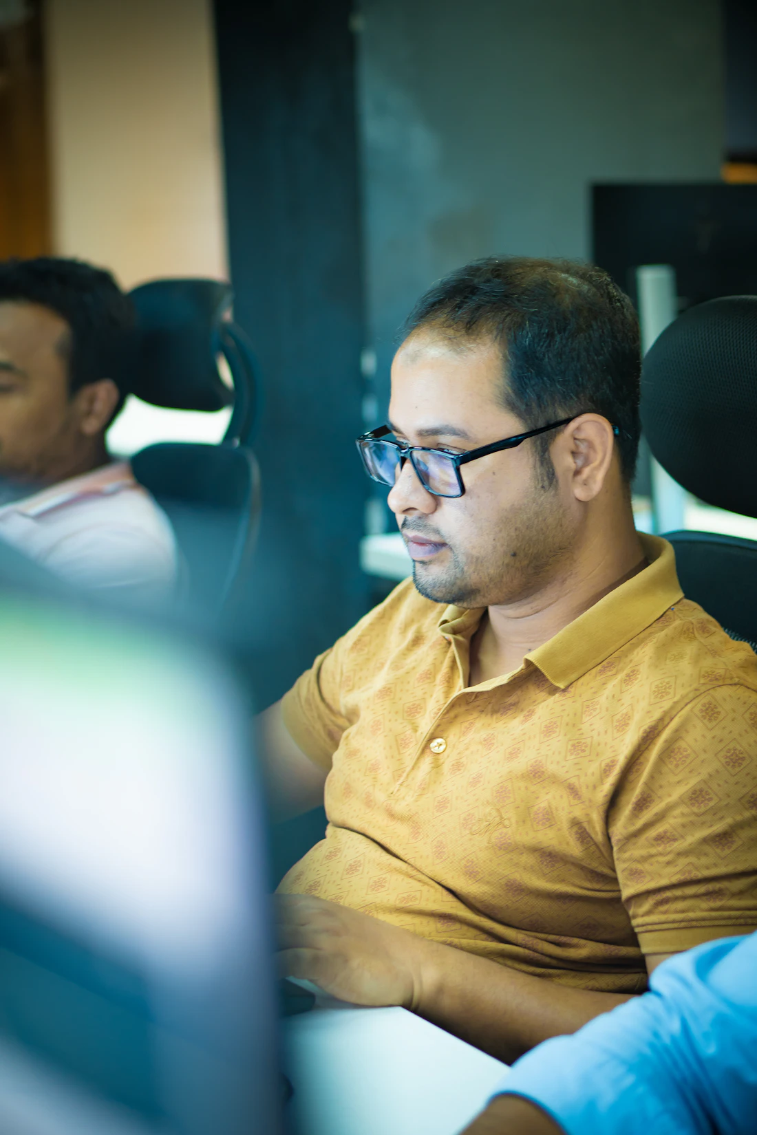A professional working at a computer