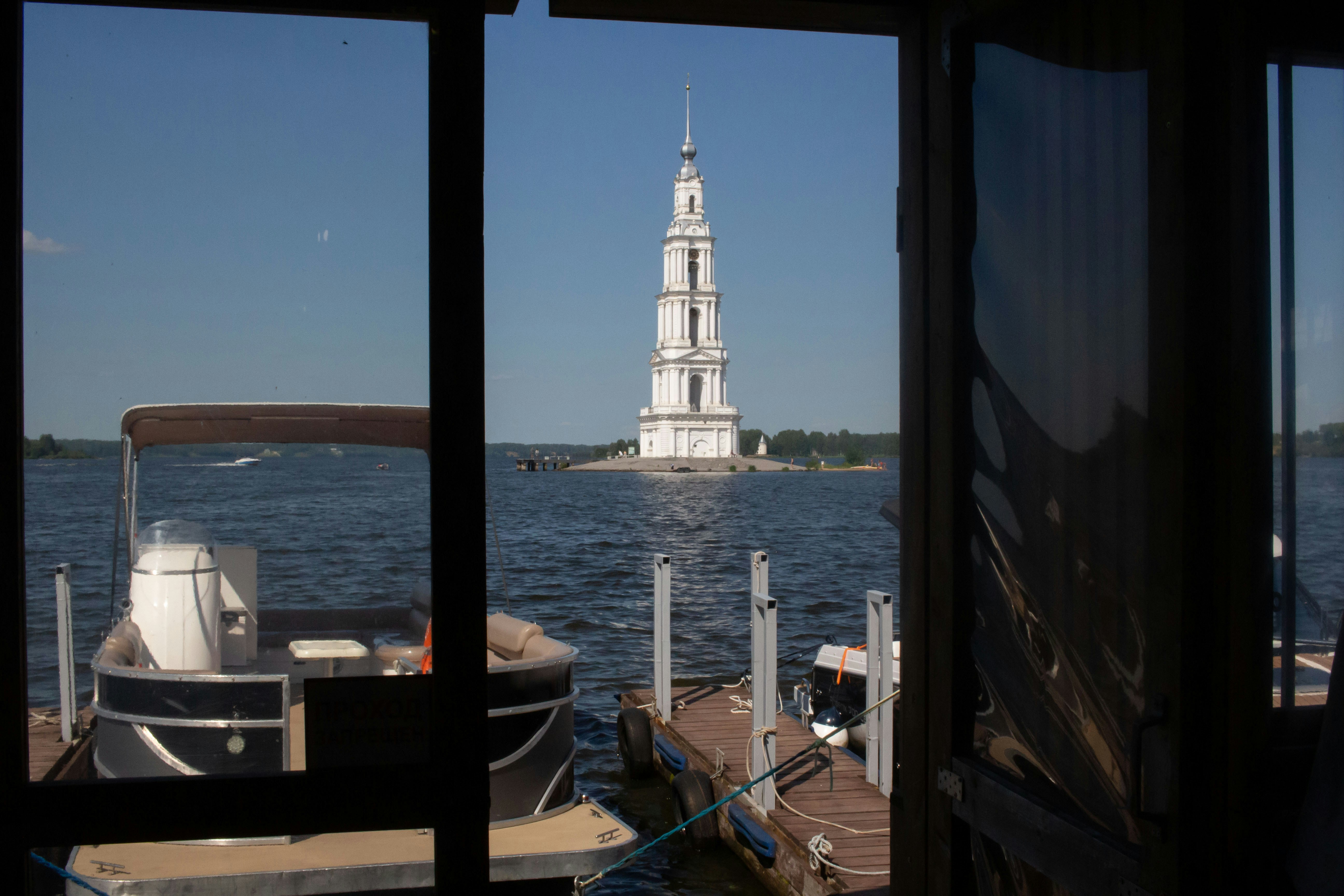 A tower rises above the waters.