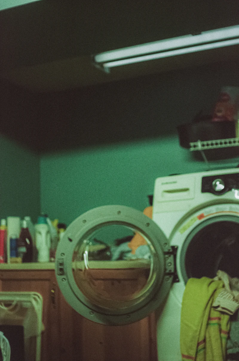 Open washing machine in a home laundry room
