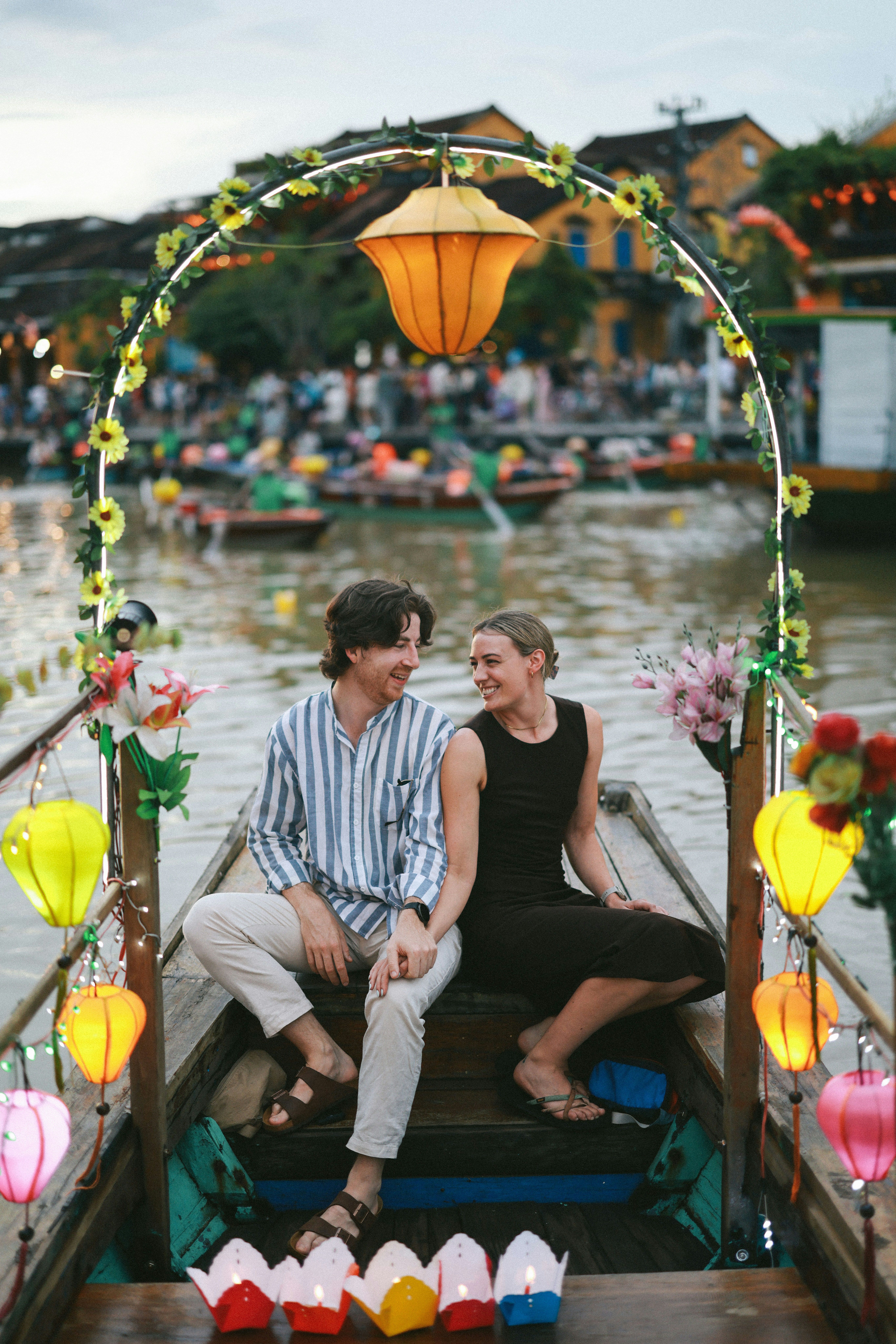 Couple enjoys a boat ride with lanterns at sunset. photo – Free Flower ...