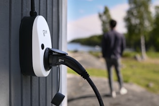 An electric vehicle charger is connected outdoors.
