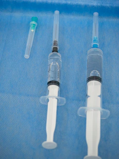 Syringes prepared for injection on a sterile surface