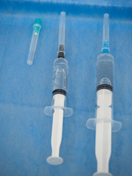 Syringes prepared for injection on a sterile surface