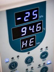 A digital display shows pressure and temperature readings.