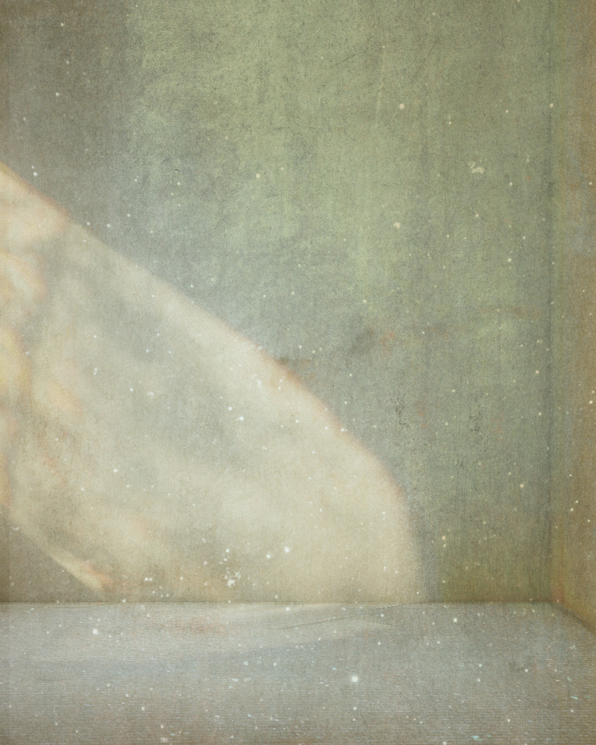 A light beam illuminates a grungy corner.