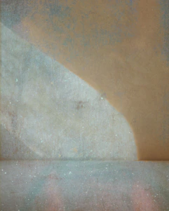 Abstract background with pale colors and textures.