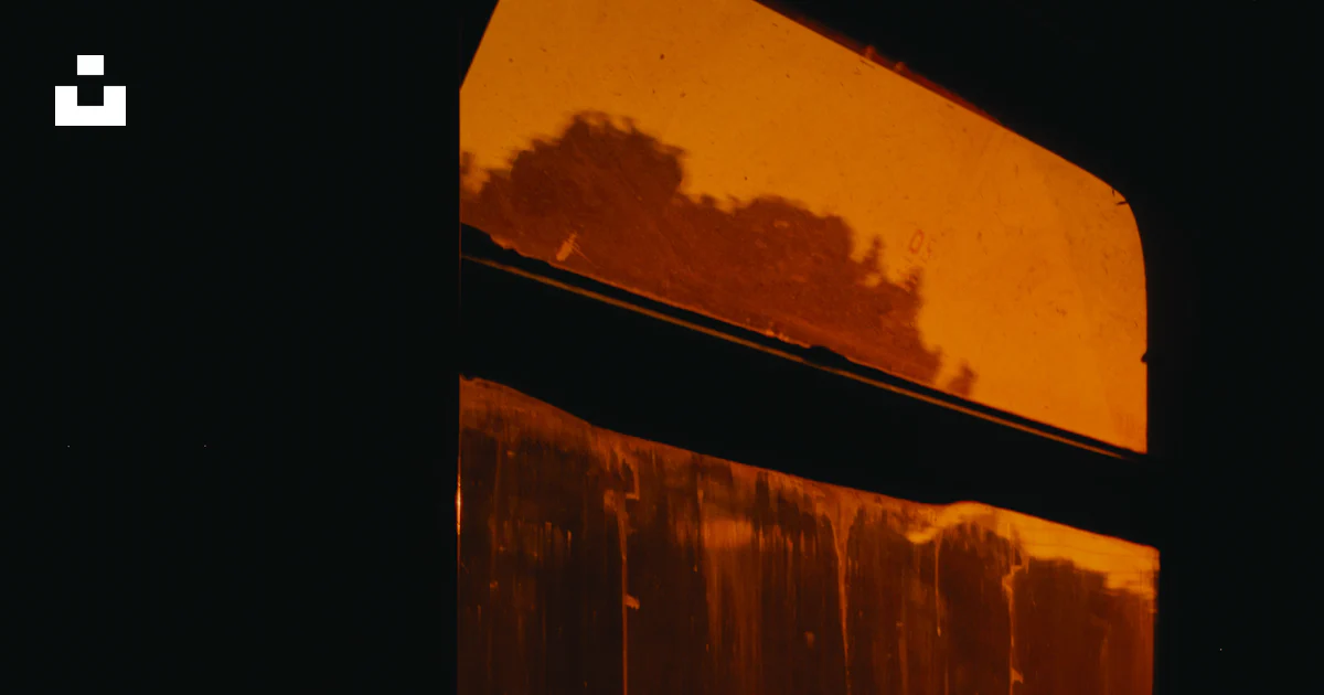 Window Light Orange Texture Orange light glows through a window in the dark. photo – Free Orange ...