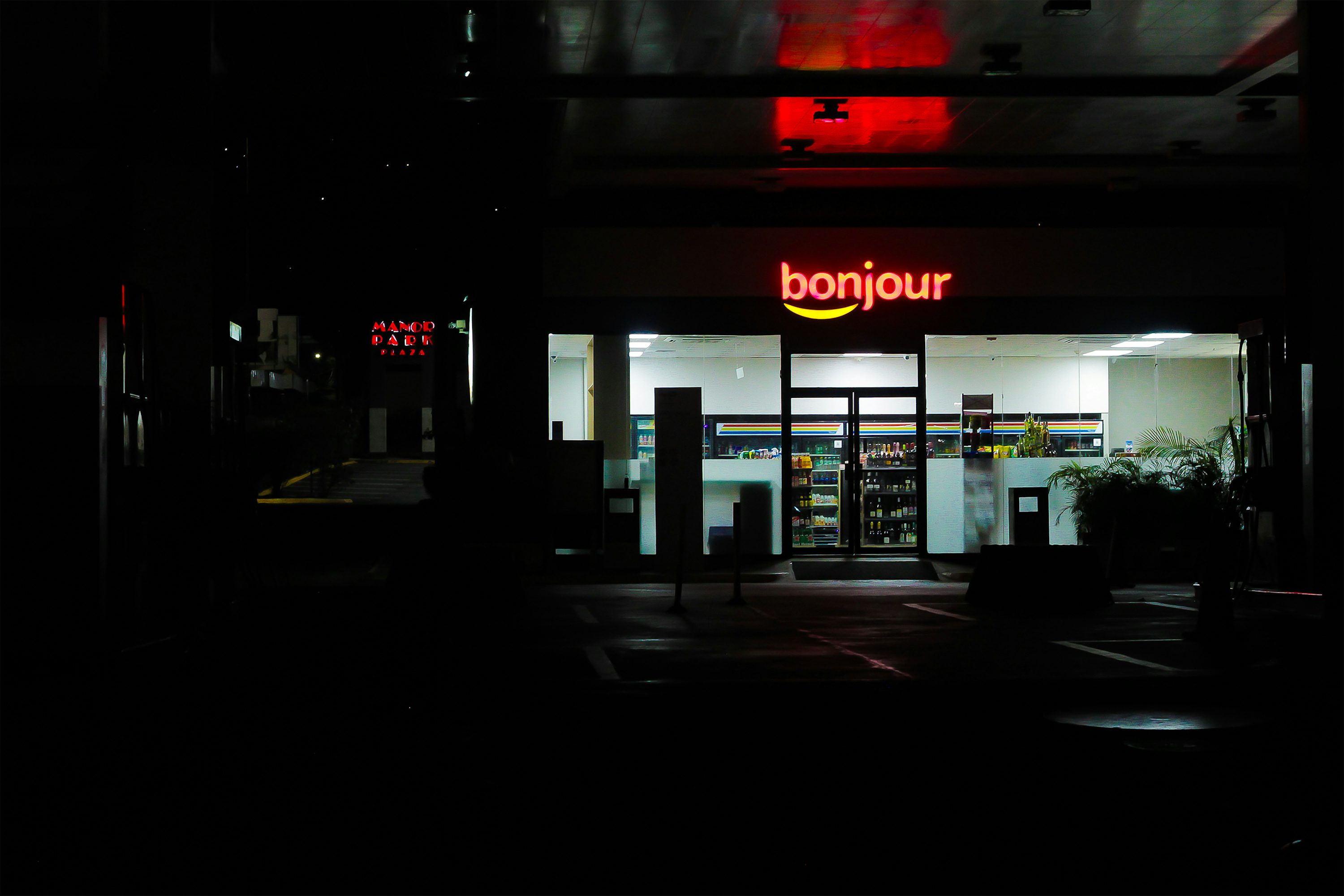 A convenience store lit up at night.