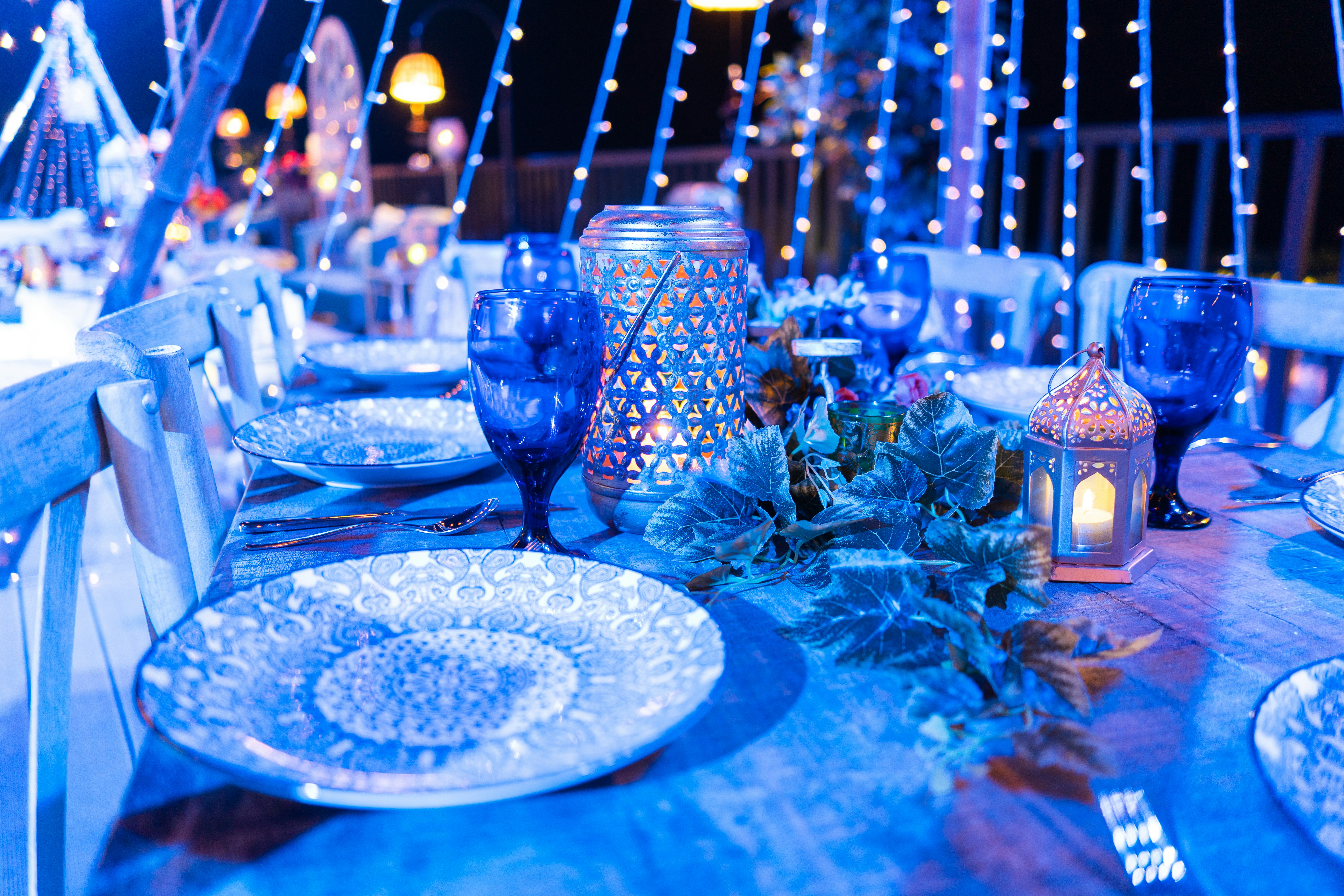 Festive table setting with blue lights