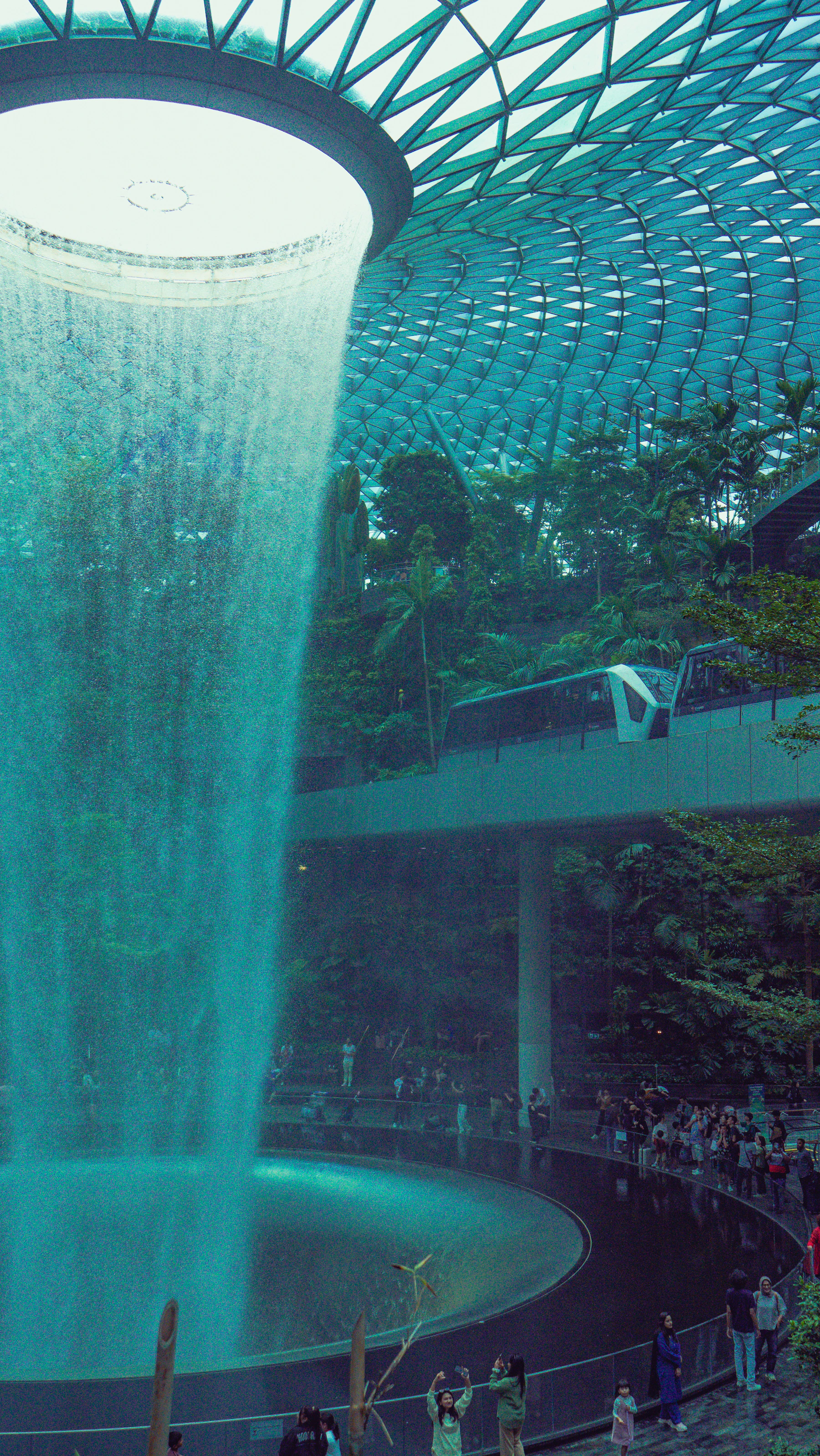 Rain Vortex surrounded by lush greenery at Jewel Changi Airport, Singapore