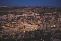 Nighttime view of a beautiful, illuminated rock city.